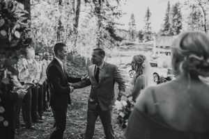 Emotional bride walks down the aisle to her groom in Boise Idaho fall wedding.