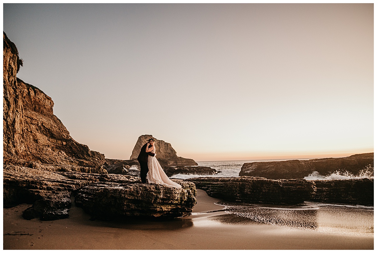 portrait of a bride and groom at the beach on their wedding day in Santa Cruz California
