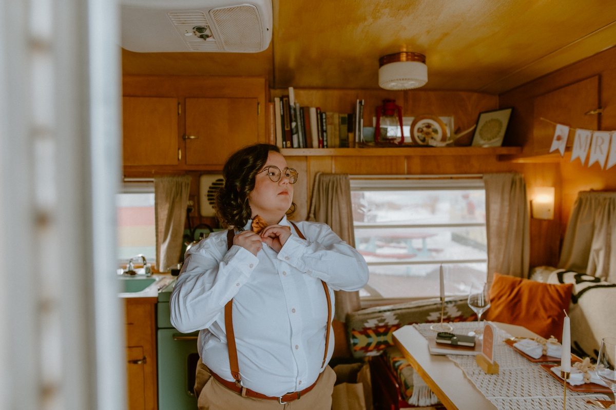 Bride gets ready for her wedding in a vintage camper in Taos New Mexico
