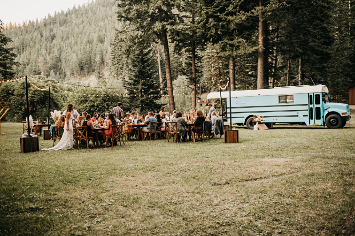 All natural farmhouse wood wedding tables for an intimate wedding in the forest 