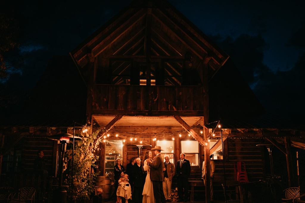 bride and groom share their first dance under the stars at the Midnight Ranch in Steamboat Springs Colorado