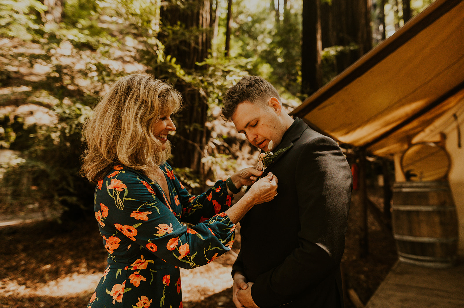 Groom's mom helps him get ready for his wedding 