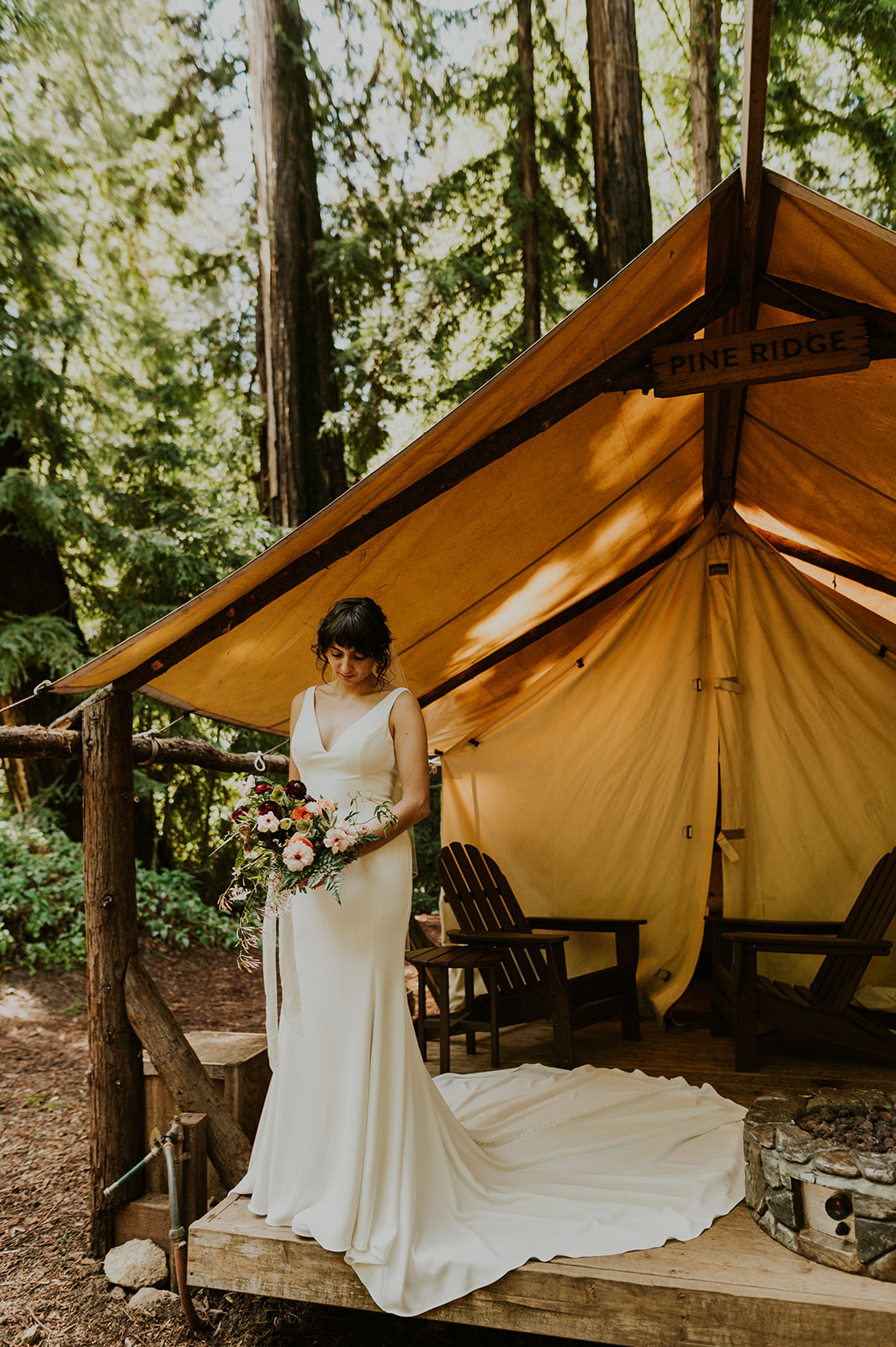 Portrait of a boho bride outside her glamping tent at the Alila Ventana in  Big Sur. 