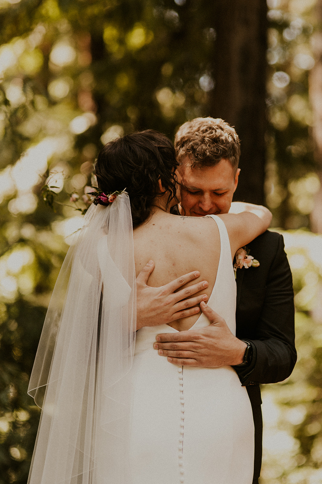 Emotional Moment between bride and groom as they share their first look in the Redwoods of California in Big Sur