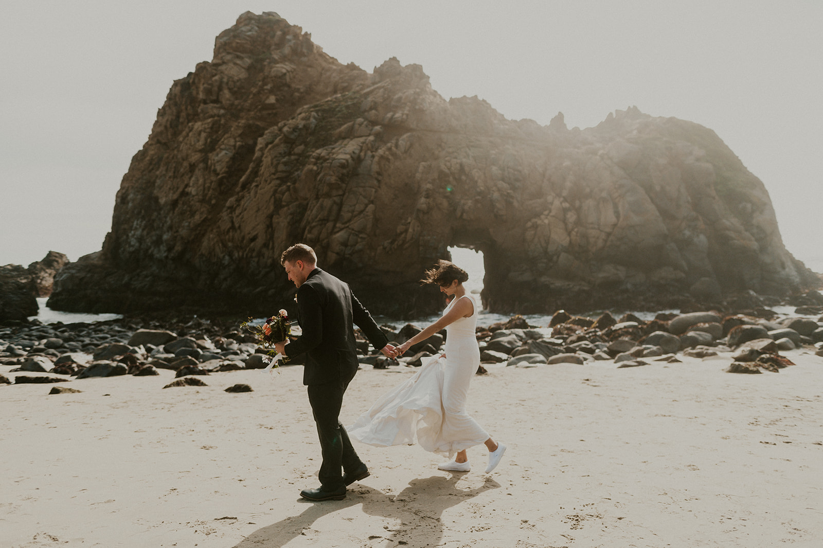Adventure Big Sur Elopement portrait of bride and groom at Pfeiffer Beach 