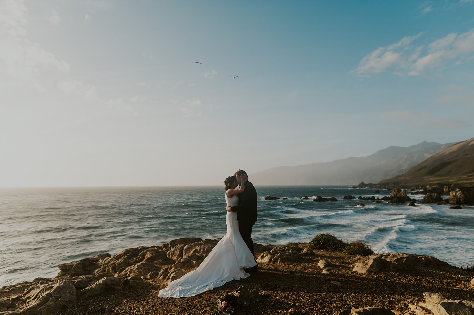 Bride and groom adventure elopement Big Sur cliffs