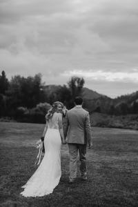Bride and groom share a romantic moment on their fall wedding day at the Sixty Chapel in Garden Valley Idaho