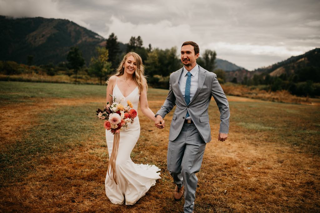 Bride and groom share a romantic moment on their fall wedding day at the Sixty Chapel in Garden Valley Idaho