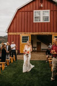 Emotional moment of Bride walkinh herself down the aisle at the Sixty Chapel Wedding Venue in Idaho