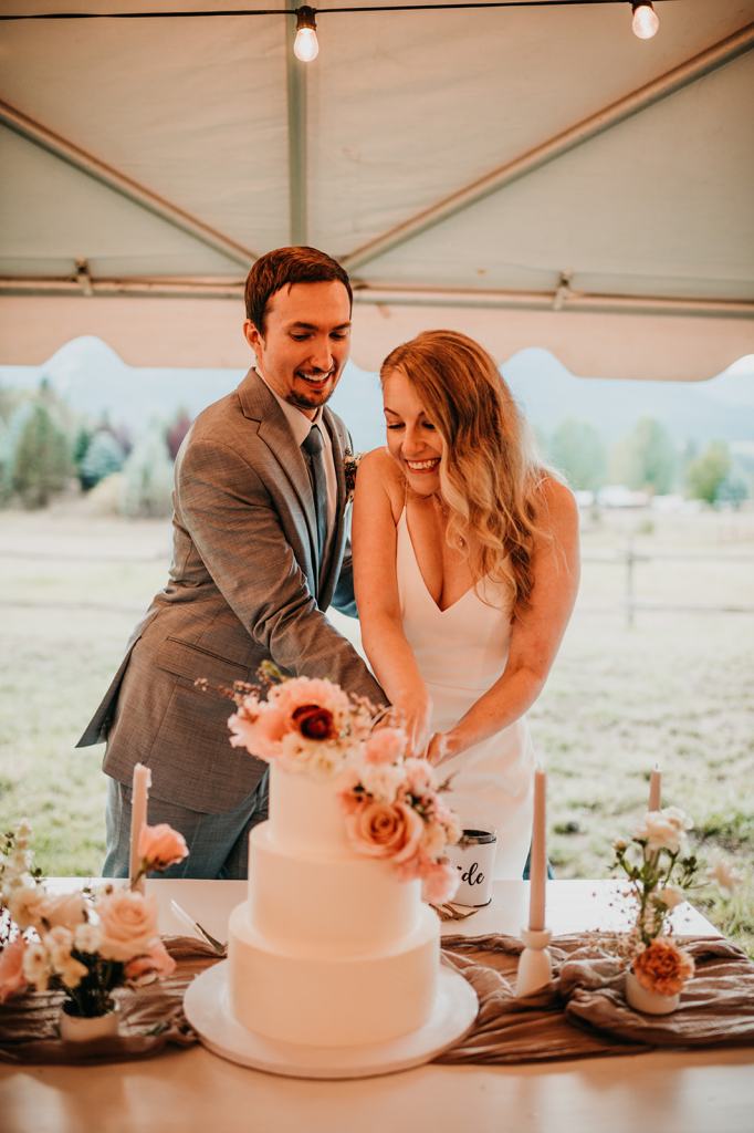 bride and groom cut their wedding cake at the Sixty Chapel in Idaho
