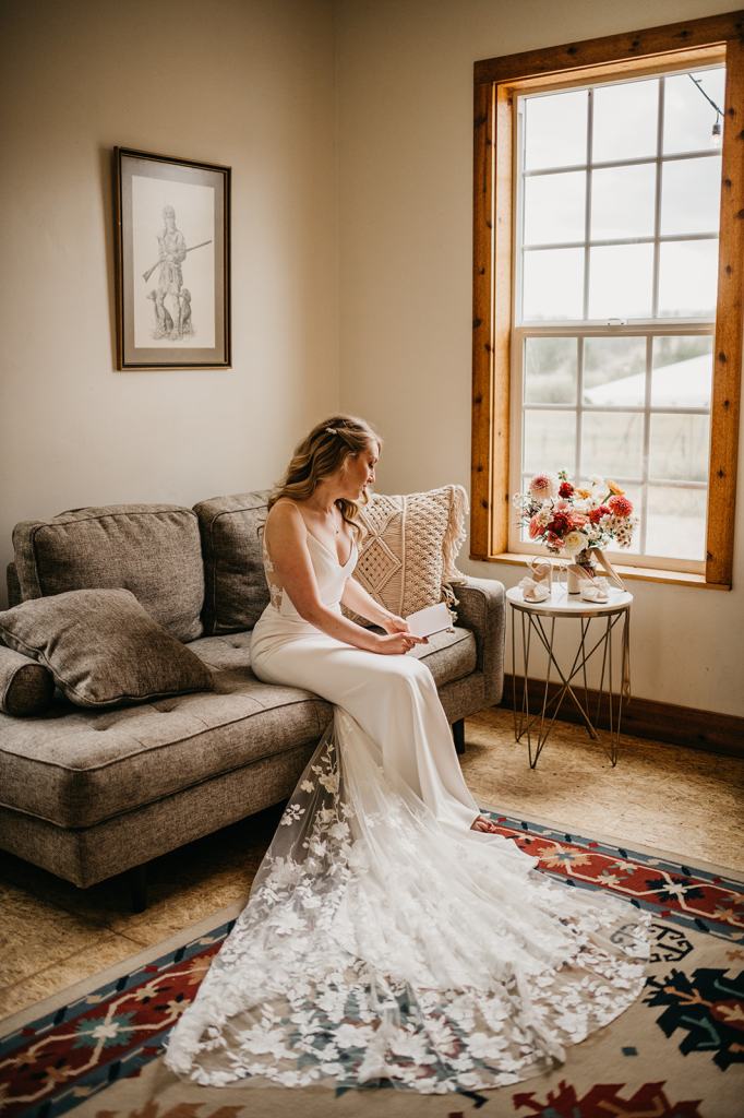 Bride reading her vows moments before walking down the aisle at the Sixty Chapel in Garden Valley Idaho