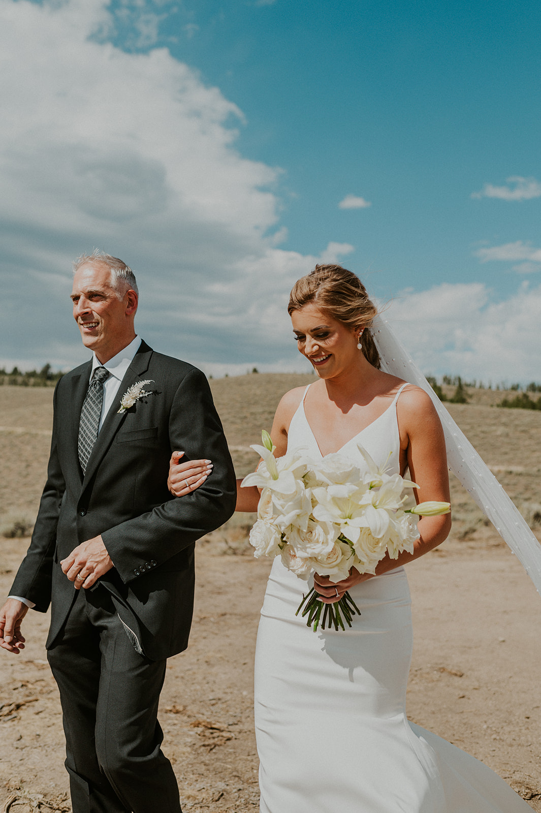 Bride walks down the aisle in Stanley Idaho at her elopement