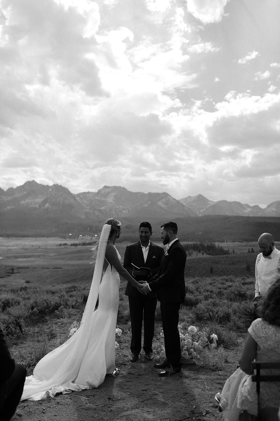 bride and groom exchange vows husband and wife in the Sawtooth mountains outside Stanley, Idaho