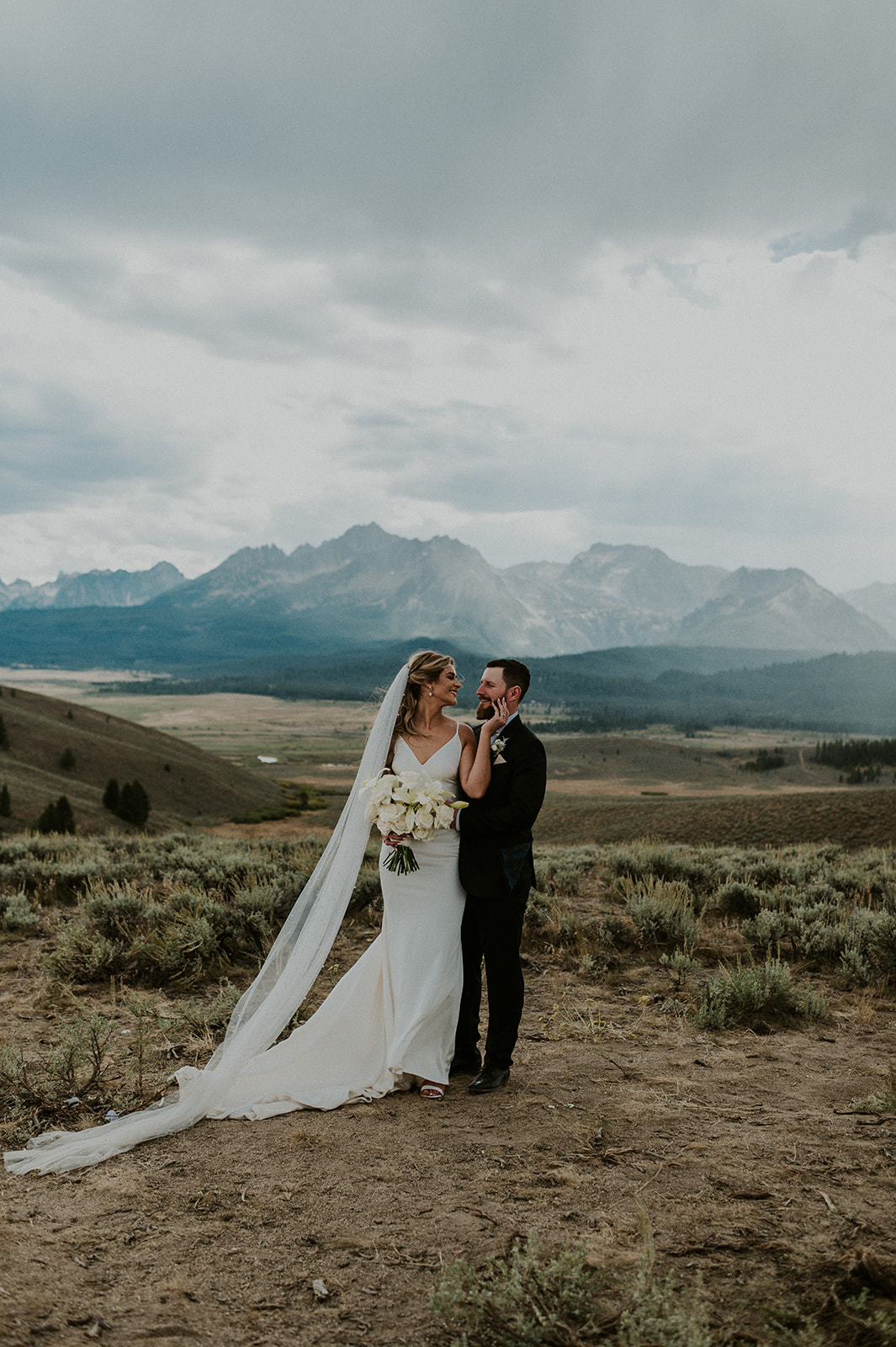 Portrait of a bride and groom on their wedding day in Stanley Idaho. 