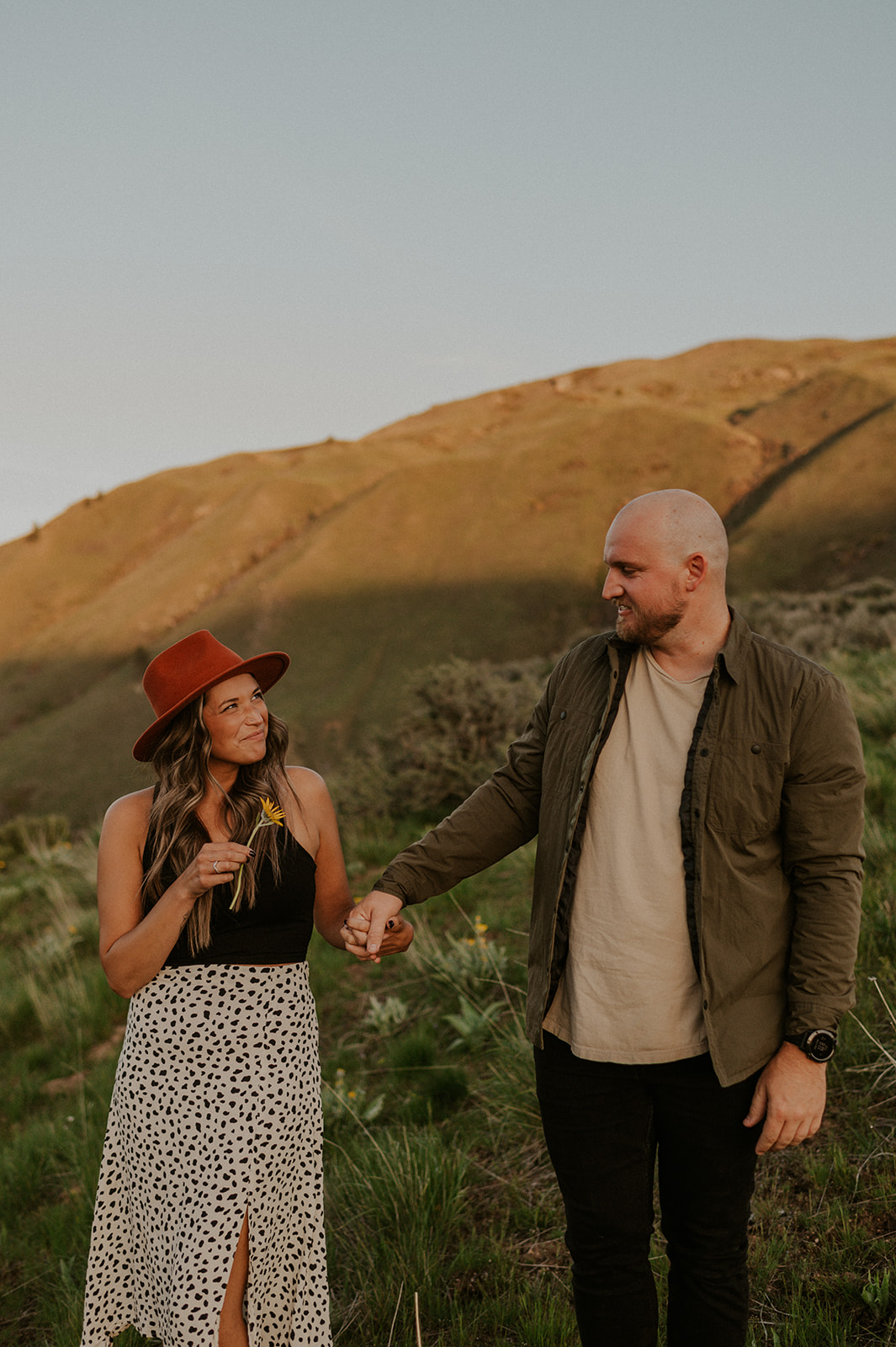 Candid moment of couple laughing during their adventure engagement session in Boise Idaho