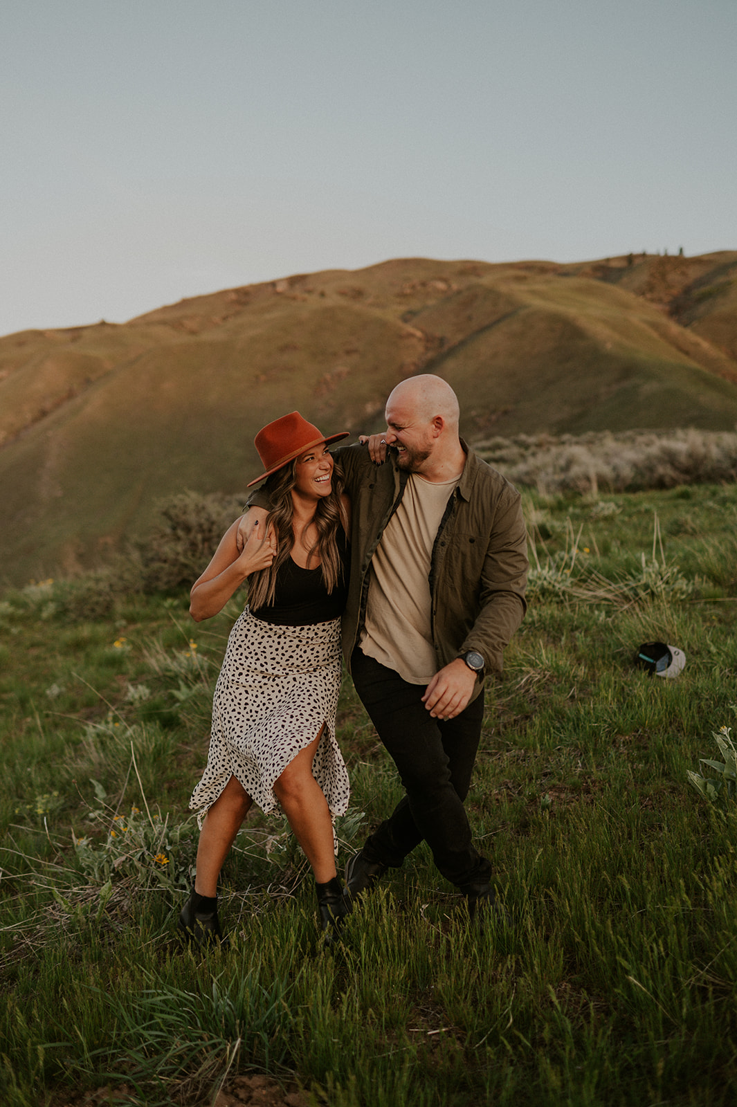 Candid moment of couple laughing during their adventure engagement session in Boise Idaho