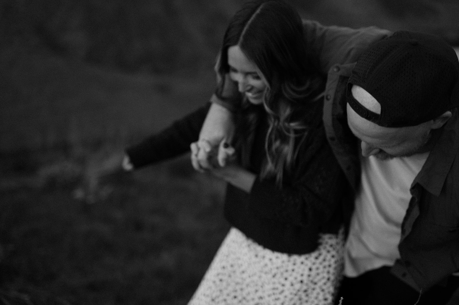 blurry black and white candid engagement photo portrait