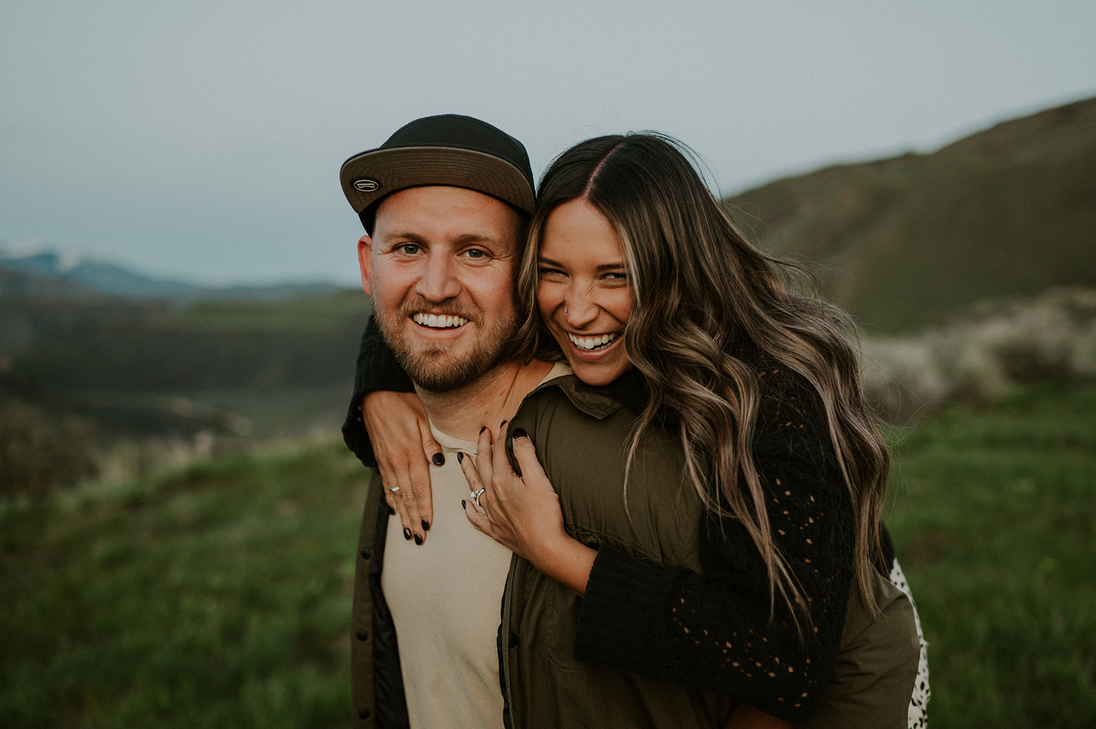 Adventure couple engagement session in the spring foothills with the snake river in Boise Idaho 