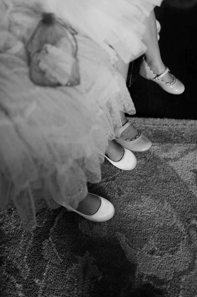 Black and white portrait of Flower girls getting ready 