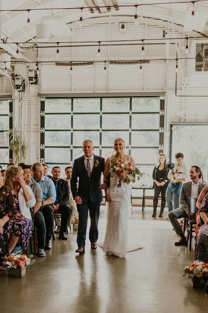 Father walks daughter down the aisle at Coopers Hall in downtown Portland Oregon
