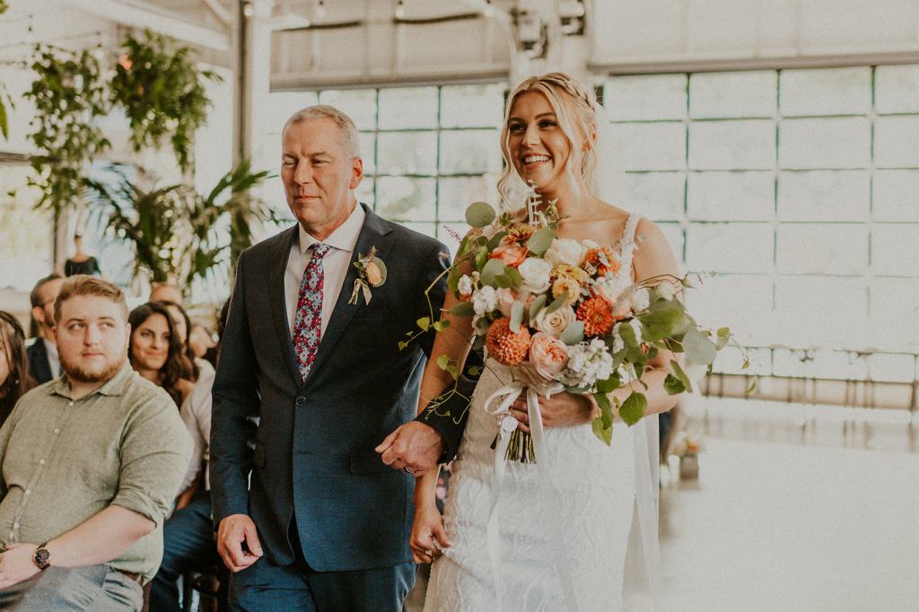 Father walks daughter down the aisle at Coopers Hall in downtown Portland Oregon