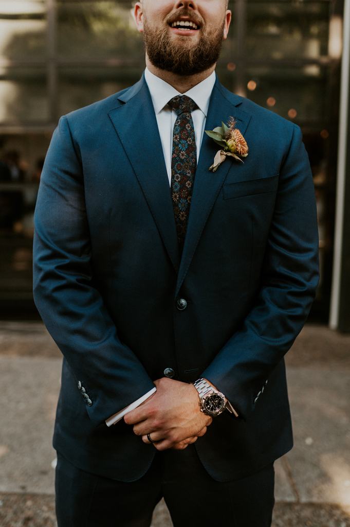 Groom Navy Suit with floral tie 