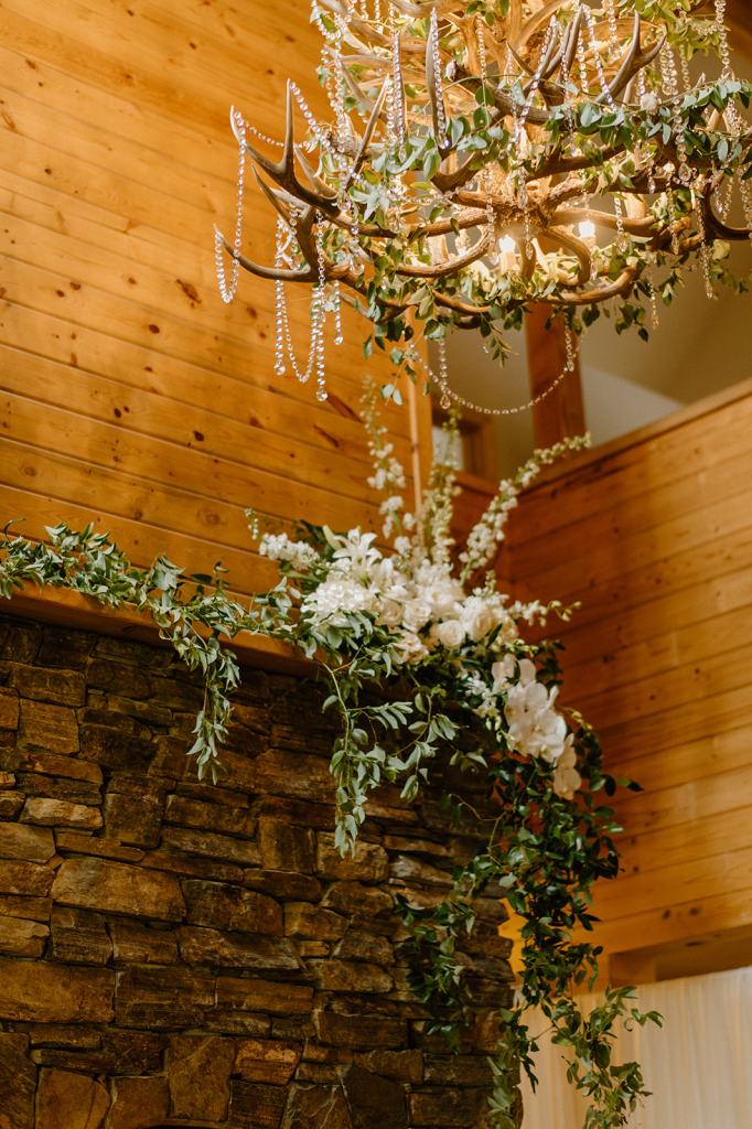 Flower Covered Fireplace Wedding Reception Decor