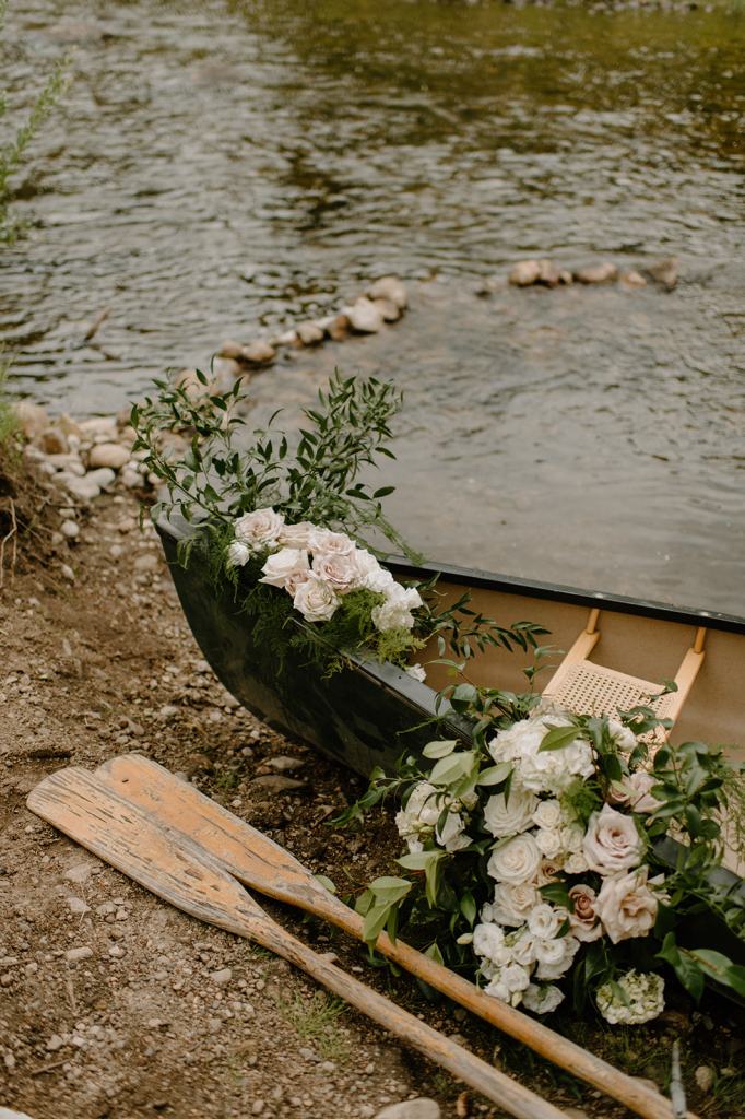 Bride and Groom Portraits in a Canoe on the River