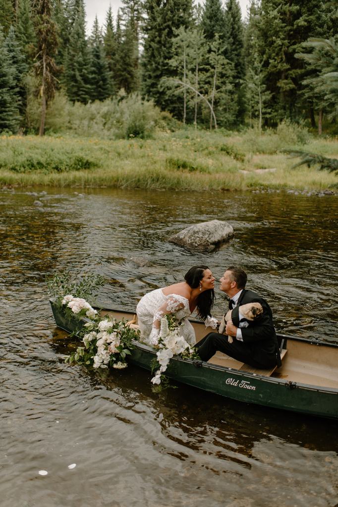 Bride and Groom Portraits in a Canoe on the River