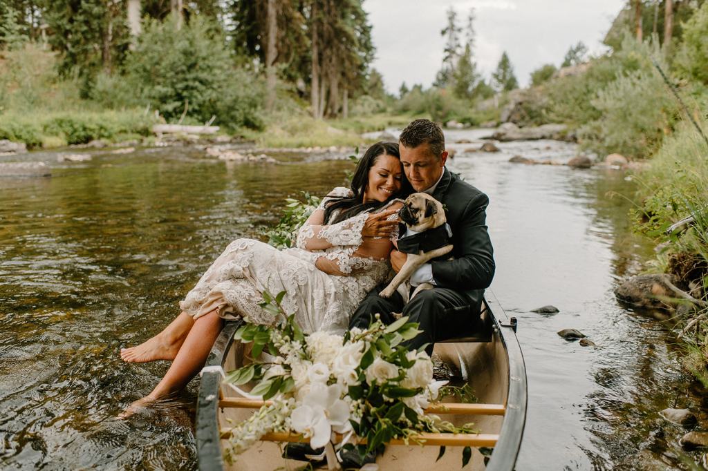 Bride and Groom Portraits in a Canoe on the River