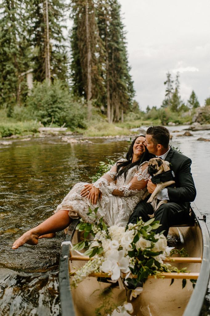 Bride and Groom Portraits in a Canoe on the River