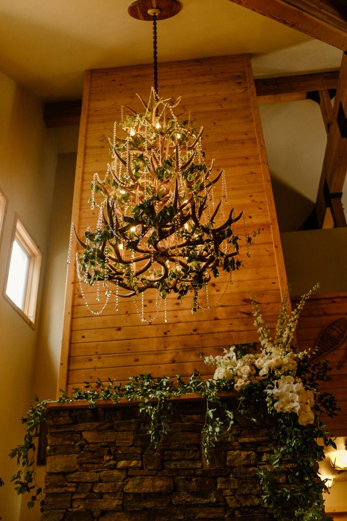 Flower Covered Fireplace Wedding Reception Decor