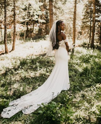 Gorgeous Black Bride wears a sweetheart deep plunge lace wedding dress with lace sleeves